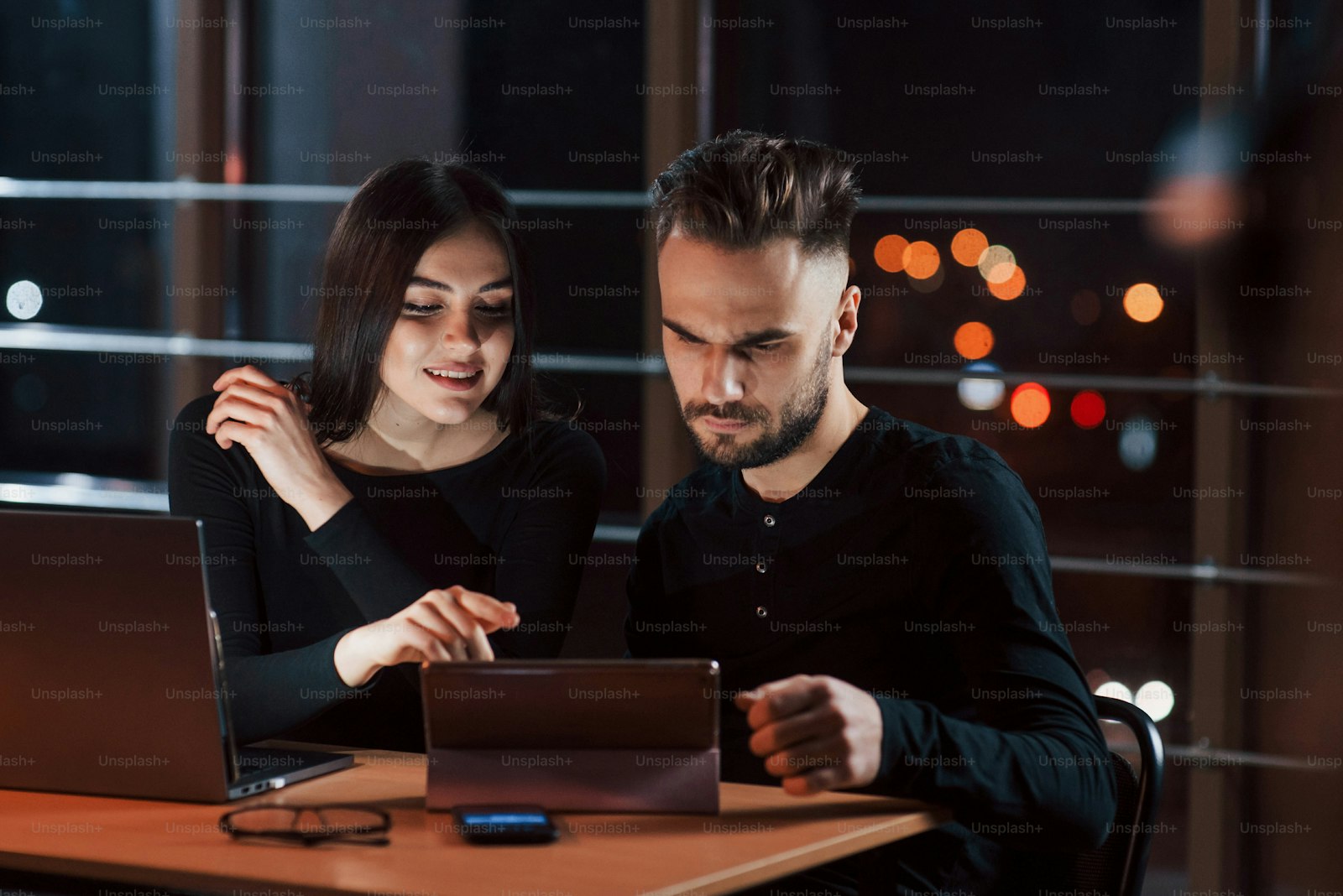 Business team working together late in a modern office